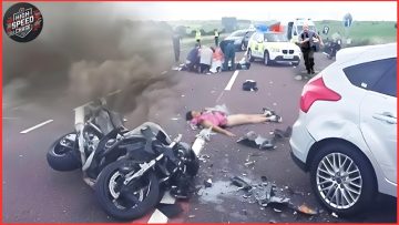 Highway accident scene with motorcycle and cars.