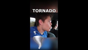 People in car, tornado warning scene