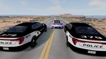 Police cars chasing a sports car on desert road.