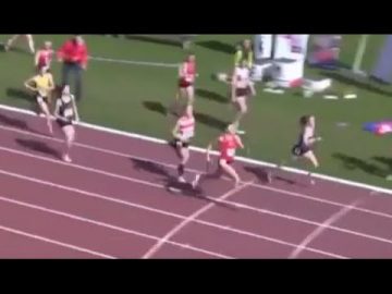 Women running in a track and field race.
