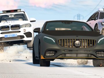 Cars racing on snowy road with police chase