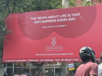 Clinic billboard about colorectal health in Chennai.