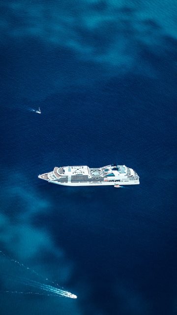 Aerial view of cruise ship on ocean.