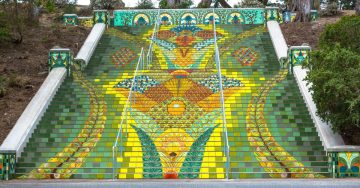 Colorful mosaic staircase with vibrant floral designs.