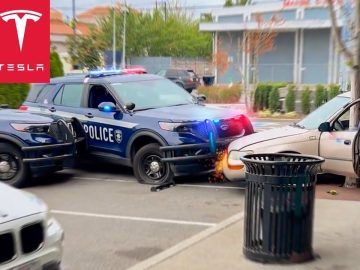 Police cars surround white car in parking lot incident.