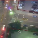 Aerial view of city intersection at night.