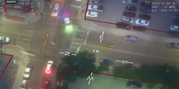 Aerial view of city intersection at night.