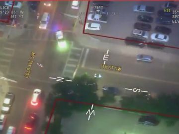Aerial view of city intersection at night.