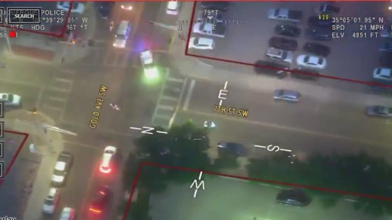 Aerial view of city intersection at night.