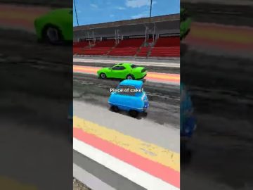 Blue car racing past green car on track.