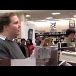 People in bookstore near checkout counters.