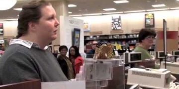 People in bookstore near checkout counters.