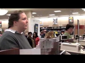 People in bookstore near checkout counters.