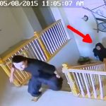 Security footage of figures on staircase, arrow pointing.