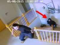 Security footage of figures on staircase, arrow pointing.