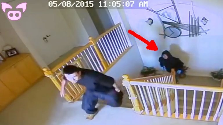 Security footage of figures on staircase, arrow pointing.
