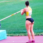 Athlete prepares for pole vault competition.