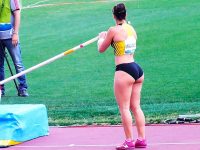 Athlete prepares for pole vault competition.