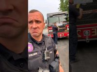 Police and firefighters near truck outdoors.