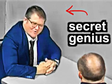 Man in suit labeled secret genius at table