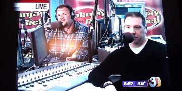 Radio hosts speaking live on air with microphones.