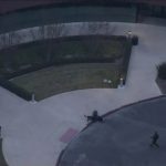 Helicopter view of building entrance and landscaping