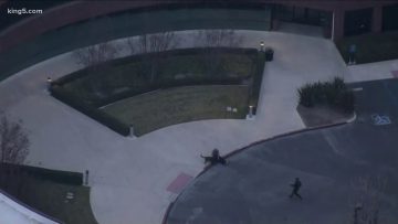 Helicopter view of building entrance and landscaping