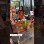 Person with cart at a Home Depot store.