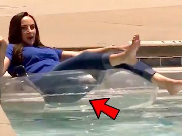 Woman on pool float with red arrow
