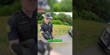 Police officer handling a glove outdoors