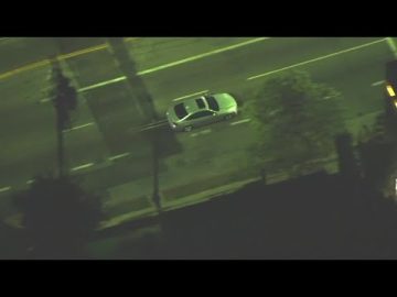 Aerial view of a car on a city street.