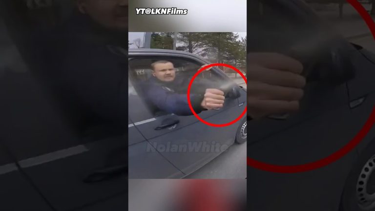 Man sprays water from car window at cyclist