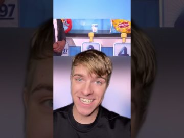 Smiling person in front of product display.