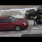 Snowy street altercation between two women.