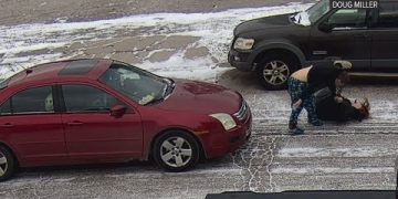 Snowy street altercation between two women.