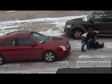 Snowy street altercation between two women.