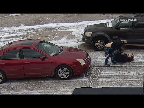 Snowy street altercation between two women.
