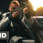 Man firing gun from car at night