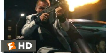 Man firing gun from car at night