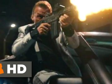 Man firing gun from car at night