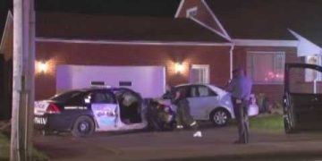 Nighttime police investigation at residential scene