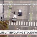 Police chase involving stolen van on city street.