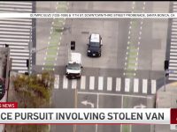 Police chase involving stolen van on city street.