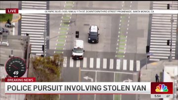 Police chase involving stolen van on city street.