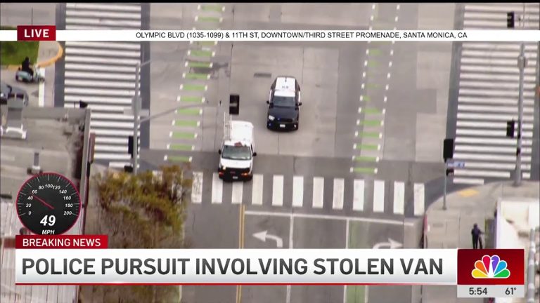 Police chase involving stolen van on city street.