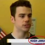 Man interviewed with USA flag background.