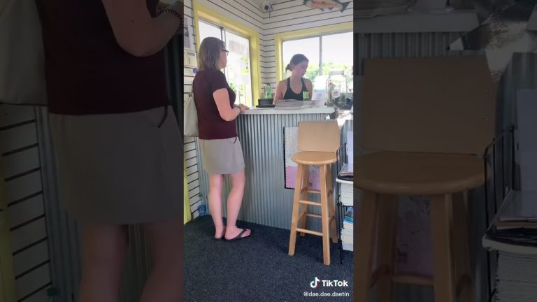 Two women talking at a small business counter