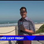 Reporter at beach for Super Lucky Friday segment.