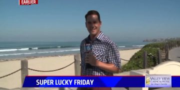 Reporter at beach for Super Lucky Friday segment.