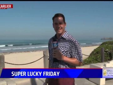 Reporter at beach for Super Lucky Friday segment.